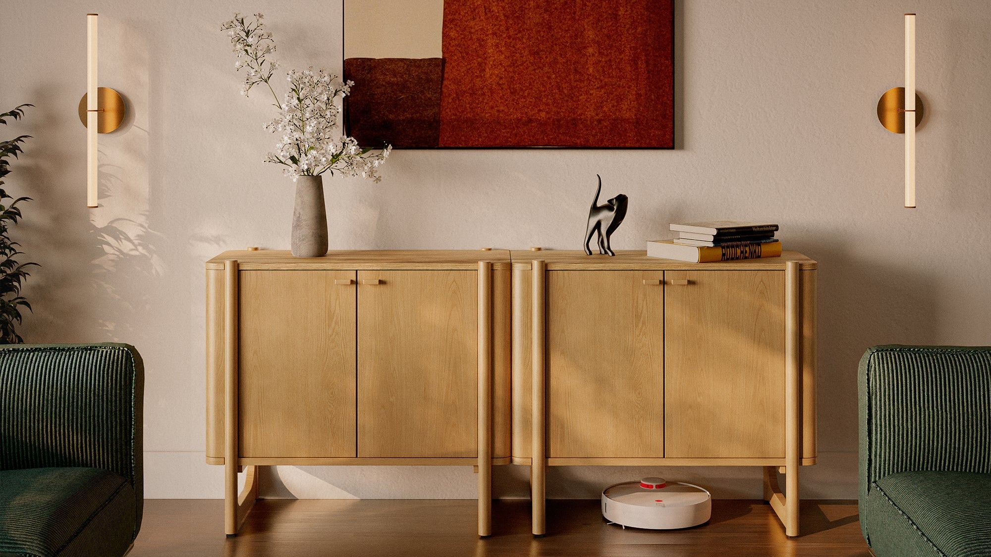 Modern living room with wooden sideboard, abstract painting, and green sofas.