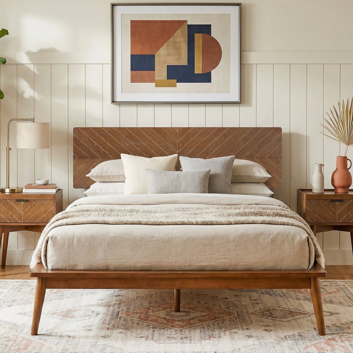 Wooden bed in a bedroom with abstract art on the wall and decorative elements.